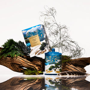 Glasshouse Fragrances Chalet Chic candle and packaging with mountain and nature design. AMBERWOOD OUD 380g Triple Scented Soy Candle Limited Edition