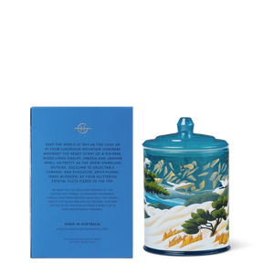 Glasshouse Fragrances Chalet Chic candle and packaging with mountain and nature design. AMBERWOOD OUD 380g Triple Scented Soy Candle Limited Edition