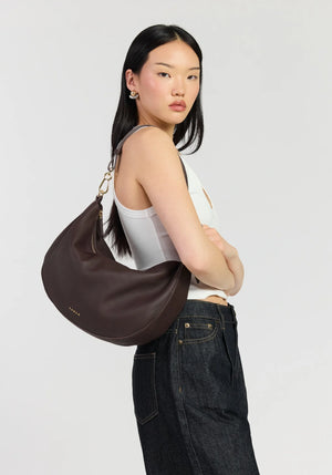 SABEN SS26 Noa Shoulder Bag - Cacao Luxe dark brown crescent-shaped leather shoulder bag