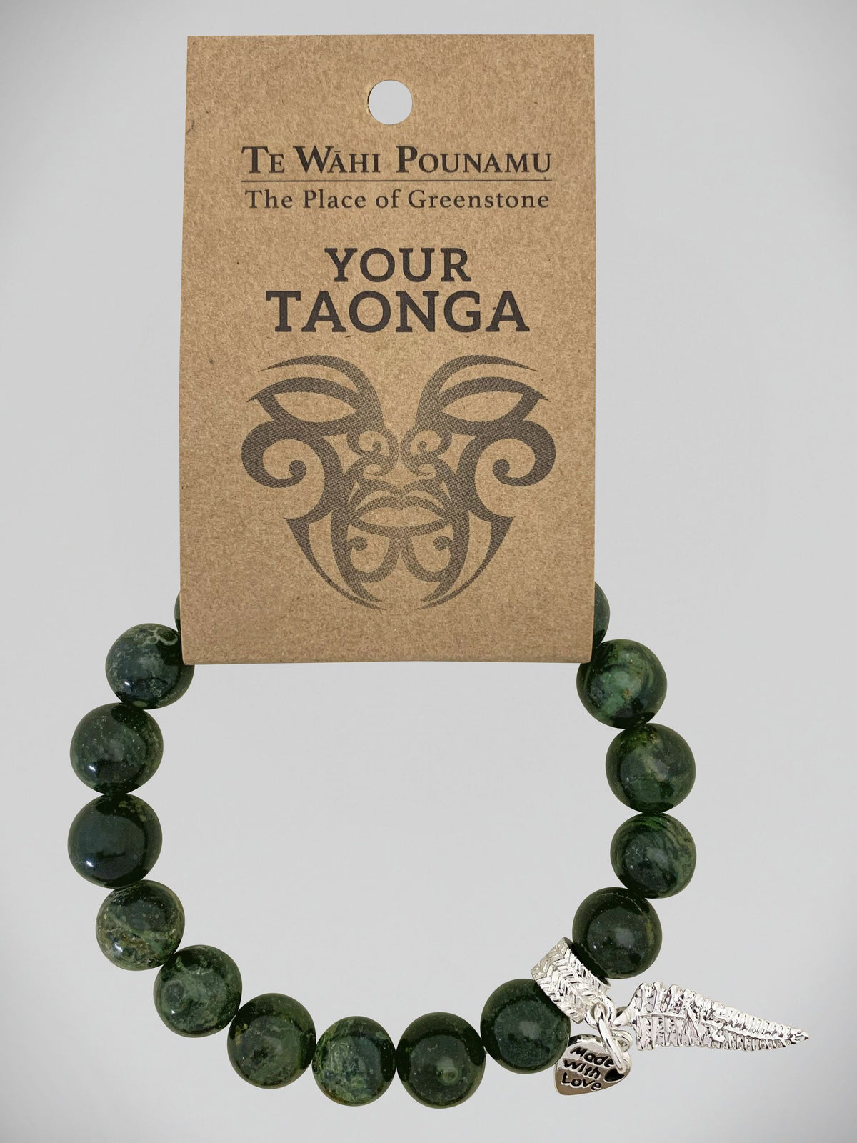Aroha Charm Nephrite Jade Bead Bracelets Greenstone bracelet with a silver charm on a 'Te Wahi Pouamu' branded card.