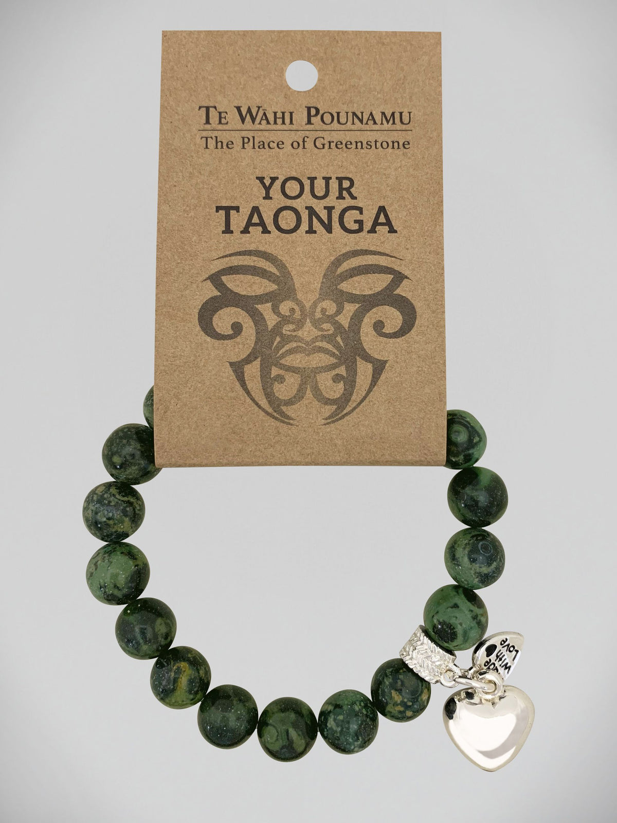 Aroha Charm Nephrite Jade Bead Bracelets Greenstone bracelet with a silver charm on a 'Te Wahi Pouamu' branded card.