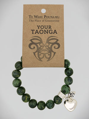 Aroha Charm Nephrite Jade Bead Bracelets Greenstone bracelet with a silver charm on a 'Te Wahi Pouamu' branded card.