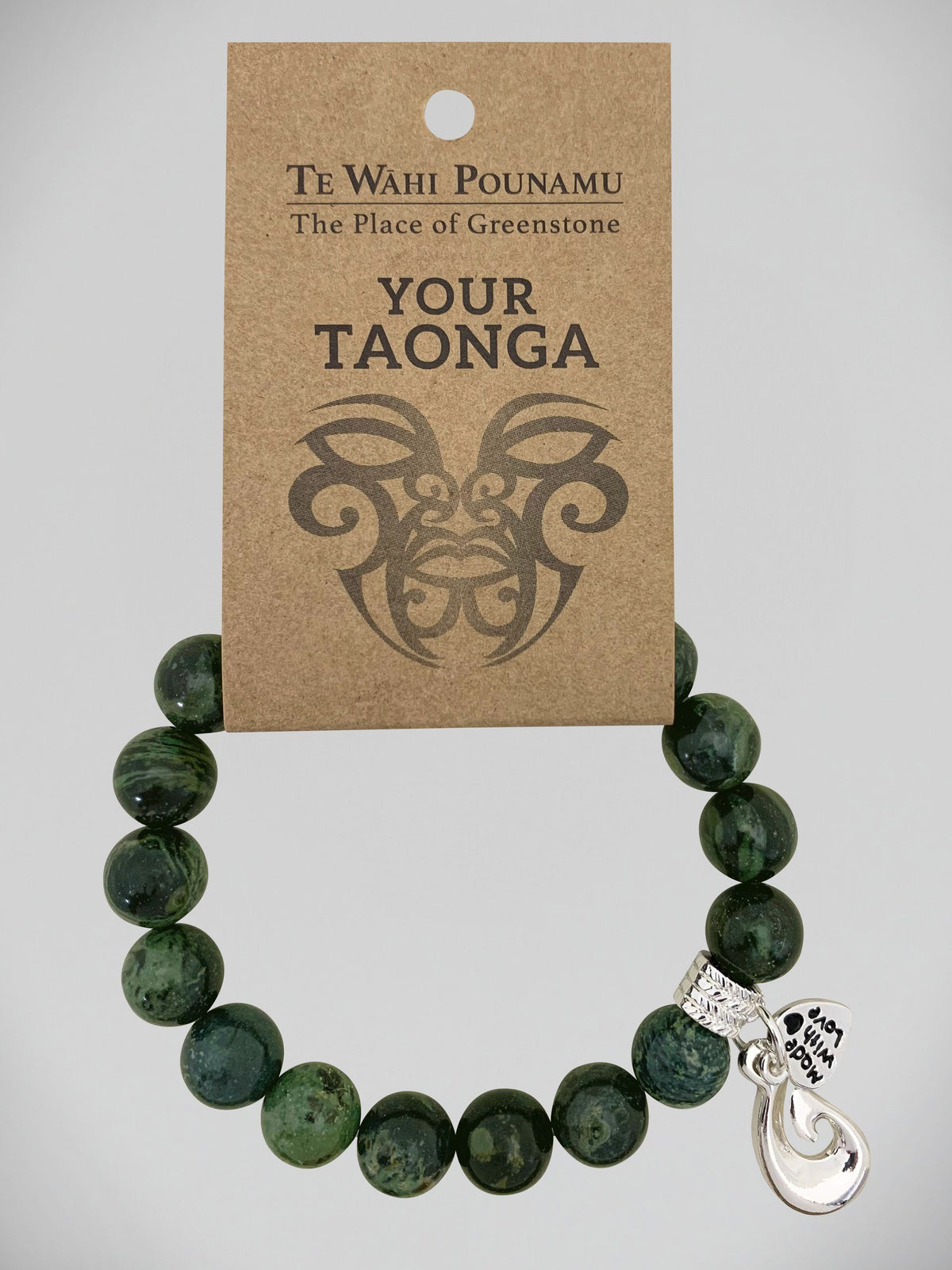 Aroha Charm Nephrite Jade Bead Bracelets Greenstone bracelet with a silver charm on a 'Te Wahi Pouamu' branded card.