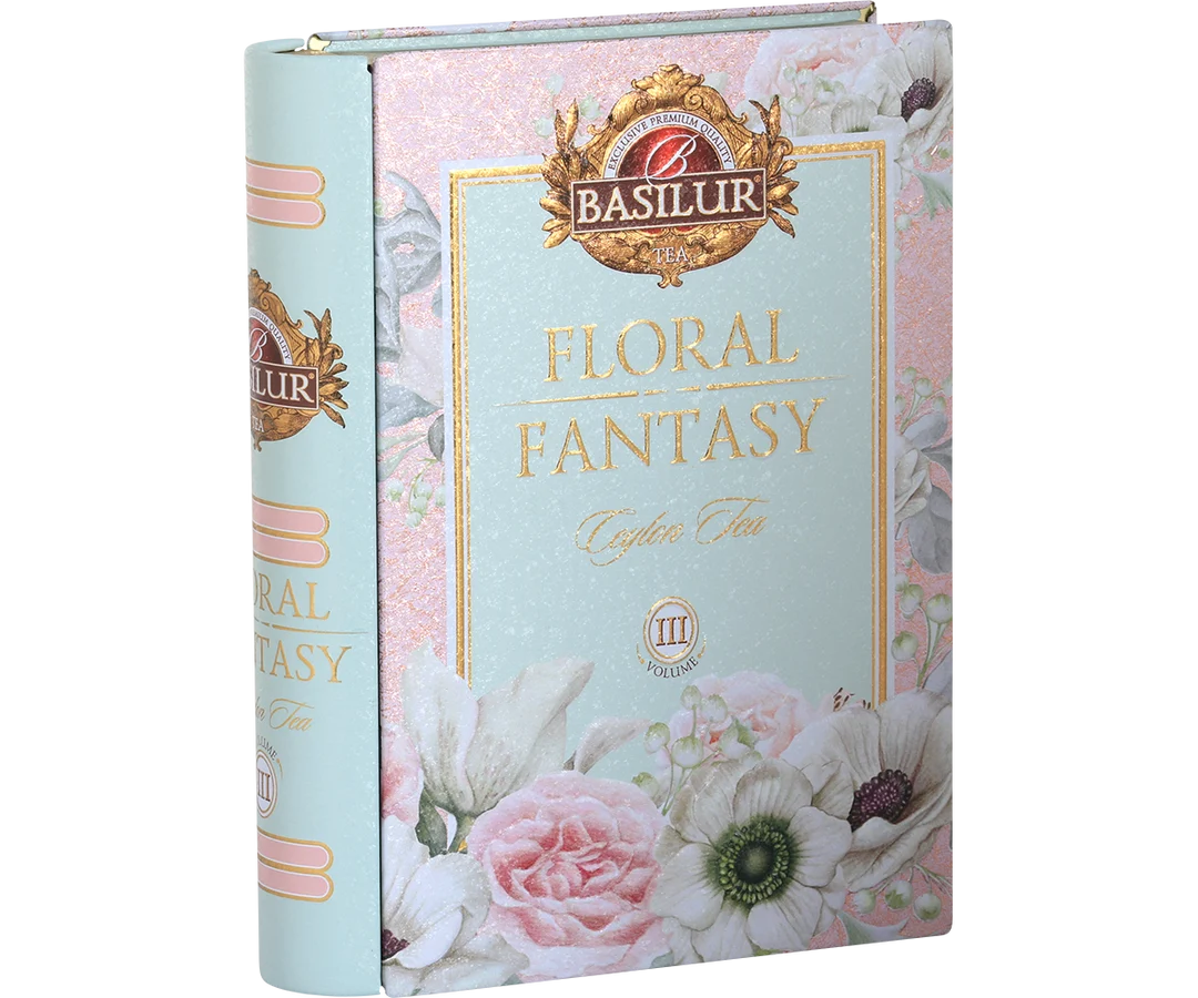 Basilur Tea 'Floral Fantasy' Ceylon Tea box packaging, featuring a pastel pink and mint green floral design with illustrations of roses, anemone, and white flowers. Floral Fantasy Volume III Tea Book - 100g Loose Leaf Green Tea