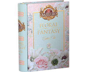 Basilur Tea 'Floral Fantasy' Ceylon Tea box packaging, featuring a pastel pink and mint green floral design with illustrations of roses, anemone, and white flowers. Floral Fantasy Volume III Tea Book - 100g Loose Leaf Green Tea