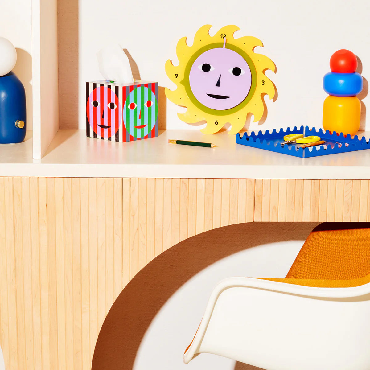 AREAWARE Dusen Dusen Everybody Clock Yellow Sun-shaped clock with a smiley face