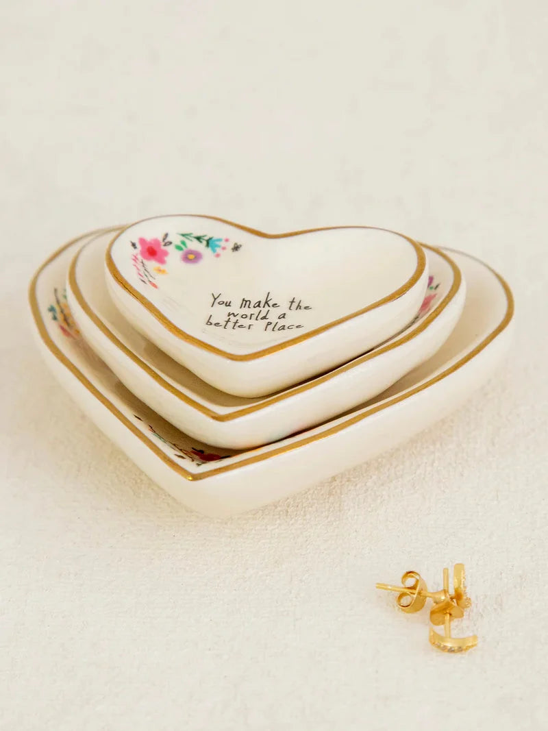 Natural Life Nesting Heart Dishes set of 3 Three small heart-shaped ceramic dishes with gold trim and floral details