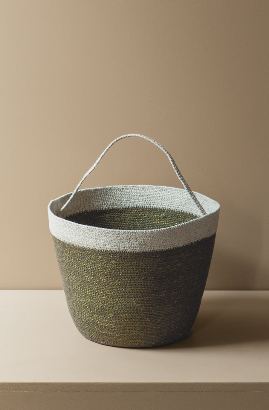 This medium scale carry basket is the perfect vessel to house your yarn and craft supplies, use as a shopping basket or to take to a casual picnic or trip to the beach. This versatile style with its interwoven handle can easily be taken from room to room, or place to place, wherever your inspiration may take you.

Earthy and calm, with rich blended hues of forest, moss and natural this colourway has a peaceful allure that evokes a soft comforting tranquility. Let this tone radiate its warmth and serenity in