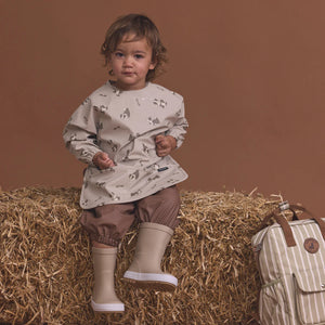 CRYWOLF MUCK-ABOUT APRON Puppies Beige long-sleeve bib with animal pattern