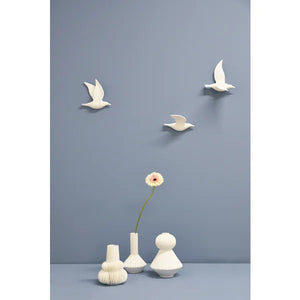 Maytime Flying Birds Single Wing WhiteA minimalist white seagull 