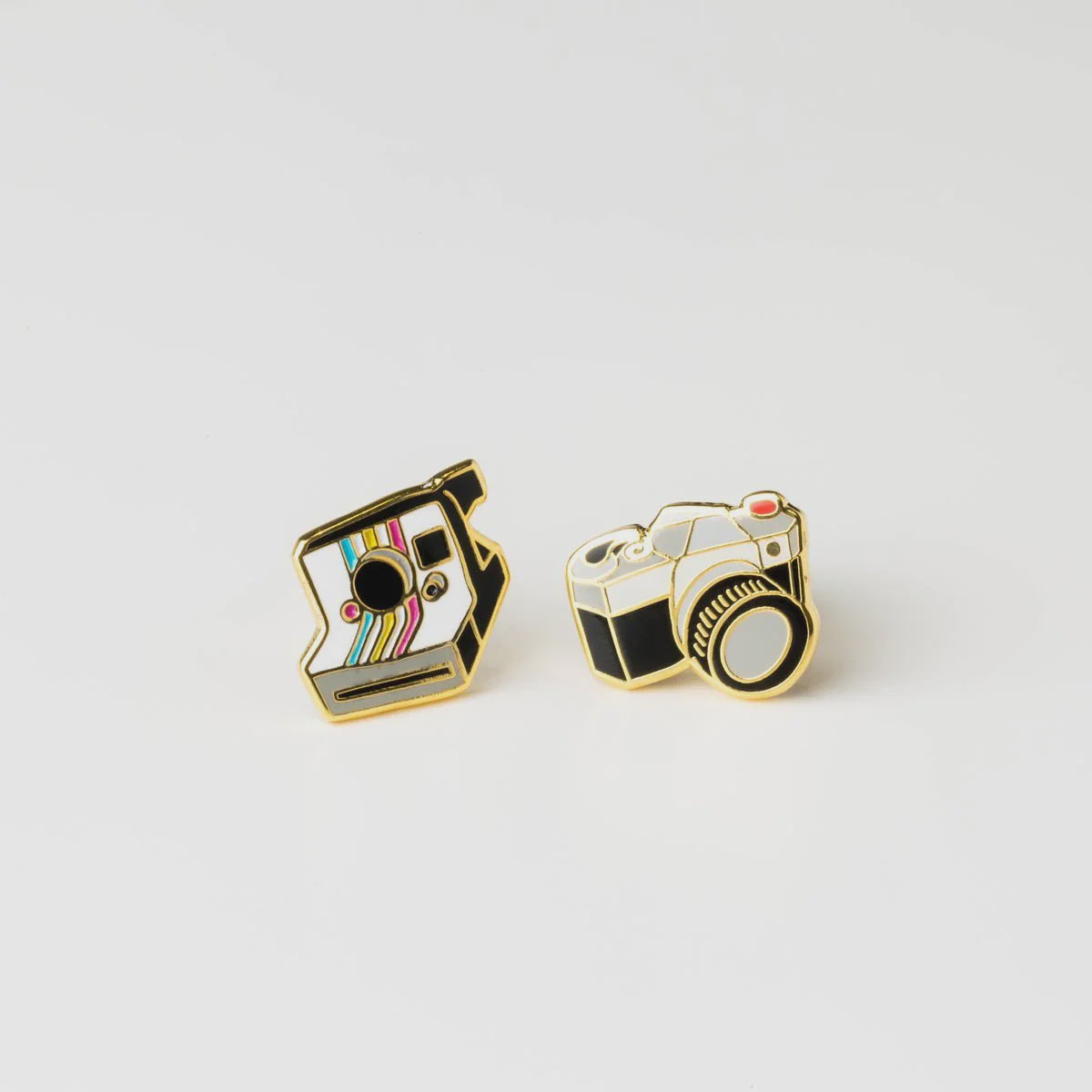 Two gold camera-shaped pins in a clear plastic case with 'Yellow Owl Workshop' branding Camera Earrings