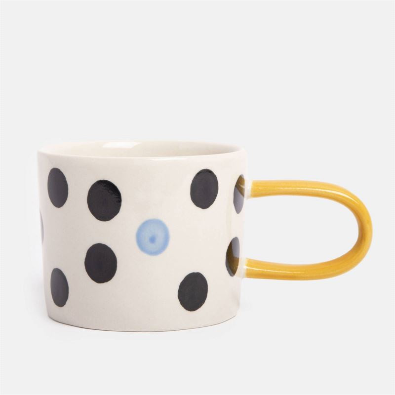 Caroline Gardner - Blue Accent Mono Dotty - Mug with black polka dots and a yellow handle