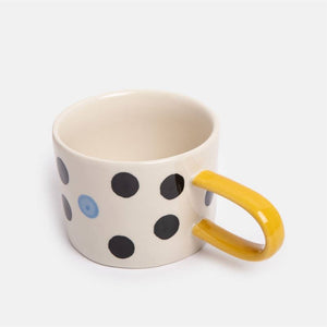 Caroline Gardner - Blue Accent Mono Dotty - Mug with black polka dots and a yellow handle