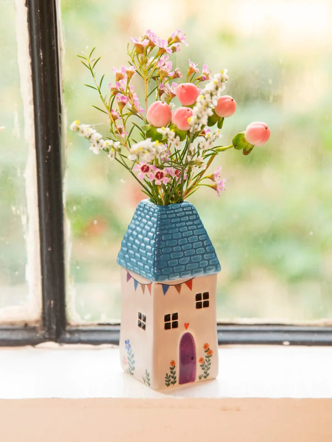 Natural Life Cottage Bud Vase - Teal Cottage Decorative vase shaped like a house with flowers on a windowsill