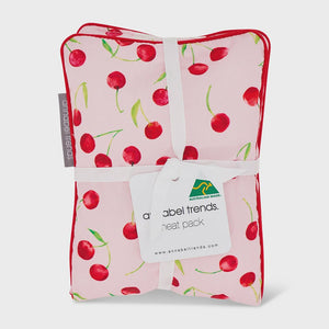 Folded pink blanket with cherry pattern and 'Australian Made' tag Cotton Heat Pillow - Cherrylicious
