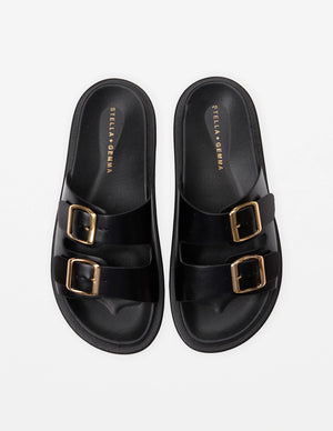 Stella+gemma Etienne Black slide sandal with gold buckles