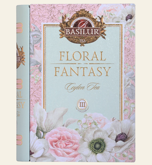 Basilur Tea 'Floral Fantasy' Ceylon Tea box packaging, featuring a pastel pink and mint green floral design with illustrations of roses, anemone, and white flowers. Floral Fantasy Volume III Tea Book - 100g Loose Leaf Green Tea