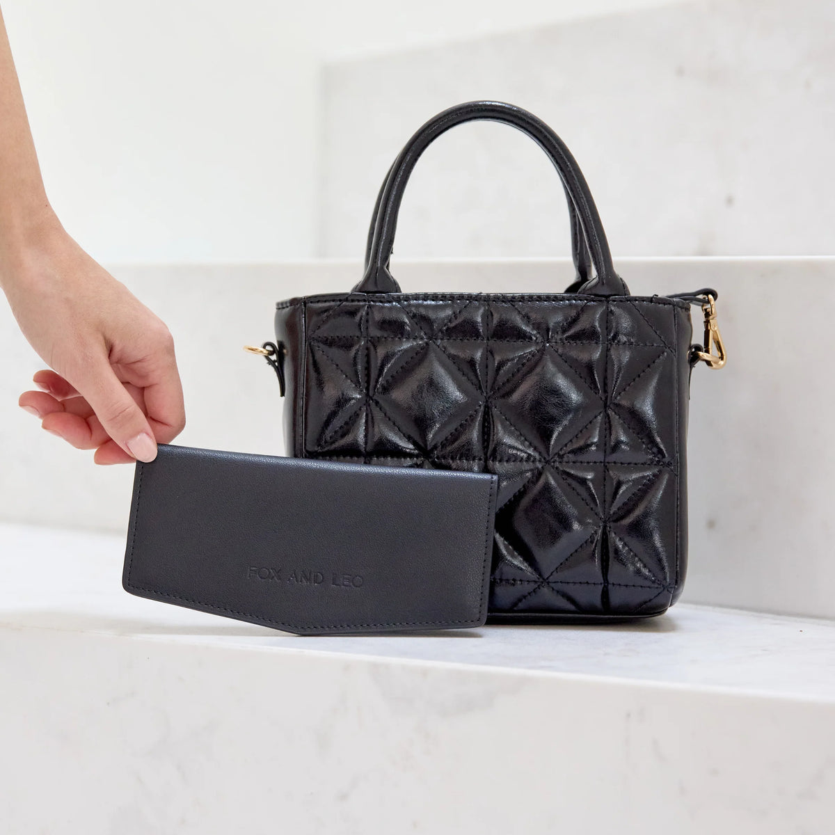 Black wallet with 'FOX AND LEO' branding The Swallet - Black