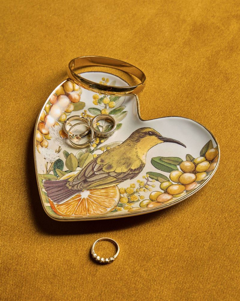 La La Land - Golden Hour - Heart Shape Trinket Tray A heart-shaped ceramic ring tray with a painted bird, flowers, and citrus design