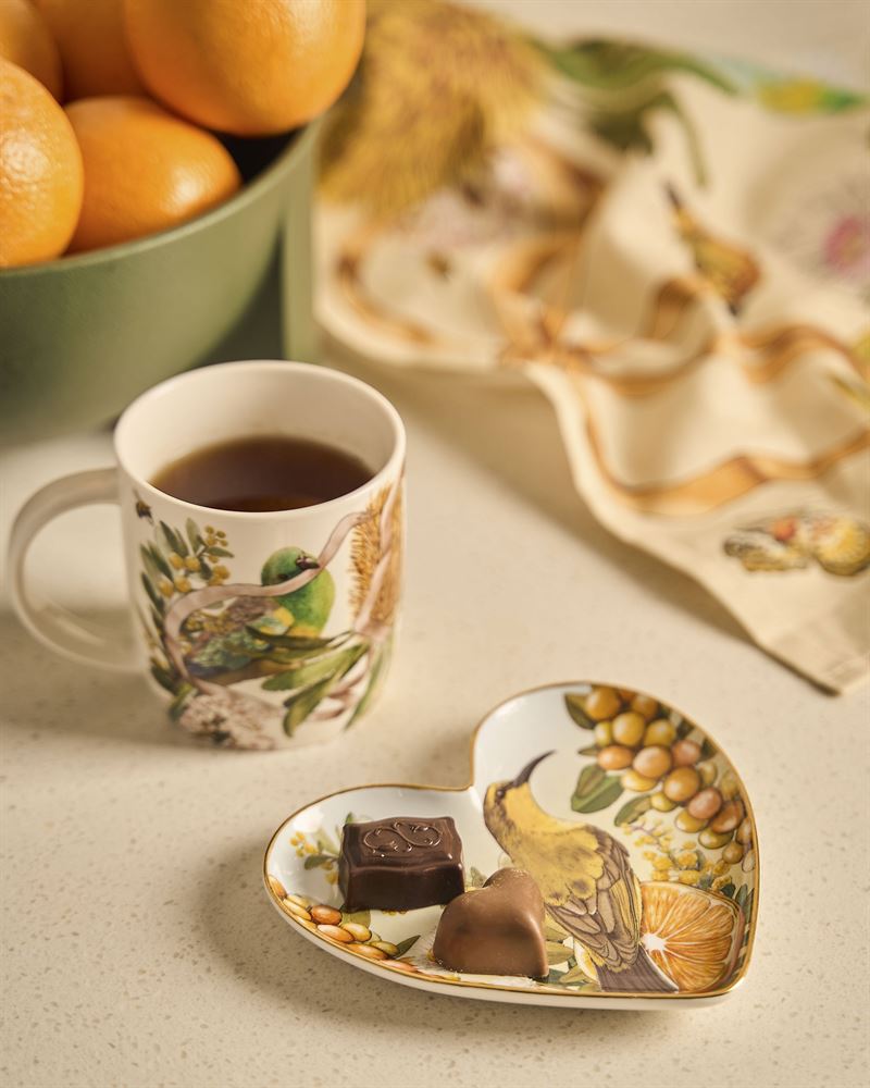La La Land - Golden Hour - Heart Shape Trinket Tray A heart-shaped ceramic ring tray with a painted bird, flowers, and citrus design