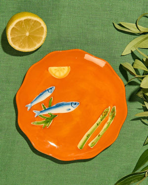 La La Land - Sardines - Stoneware Plate Orange plate with fish, lemon, and asparagus design