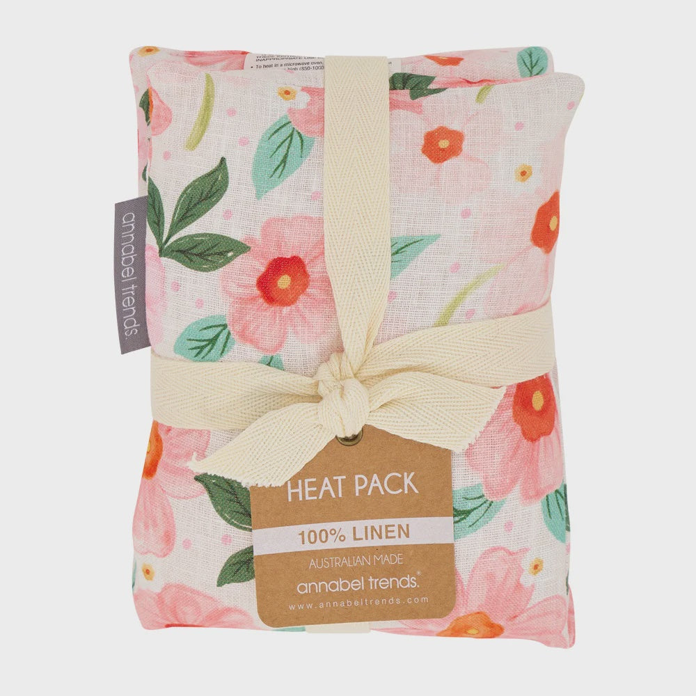 Floral-patterned heat pack with a bow and 'annabel Trends' branding Linen Heat Pillow - Meadow Blush