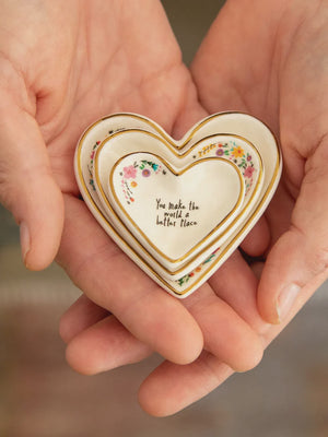Natural Life Nesting Heart Dishes set of 3 Three small heart-shaped ceramic dishes with gold trim and floral details
