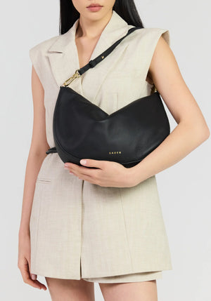 SABEN SS26 Noa Shoulder Bag - Black Luxe crescent-shaped shoulder bag