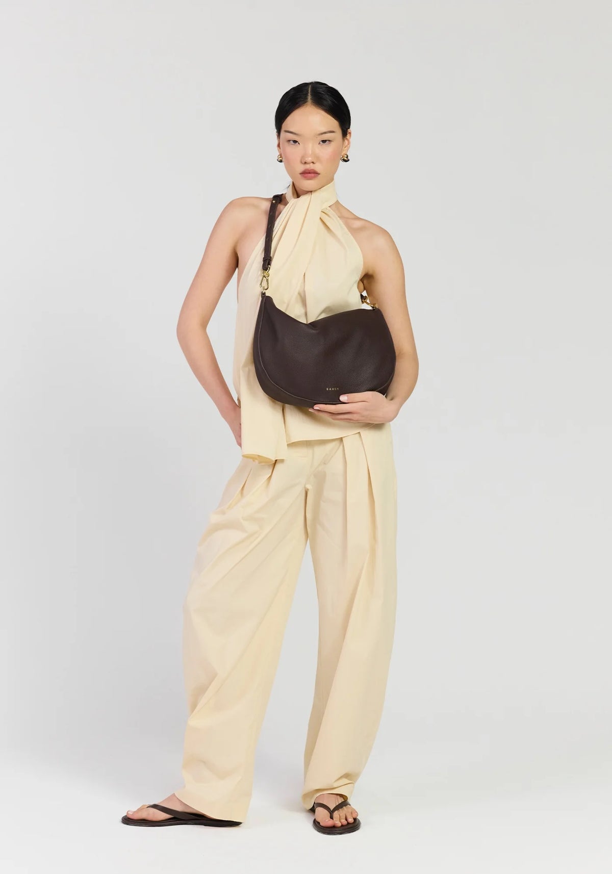 SABEN SS26 Noa Shoulder Bag - Cacao Luxe dark brown crescent-shaped leather shoulder bag
