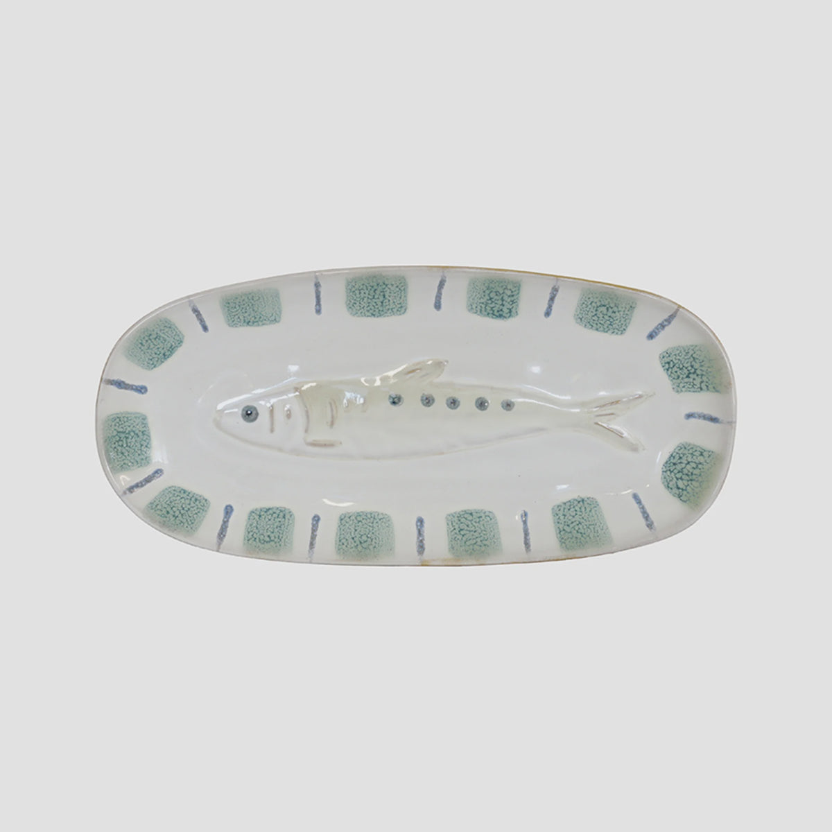 Sushi Plate Fish An oval ceramic serving platter featuring a molded fish in the center and a border of textured sage green squares with blue accents