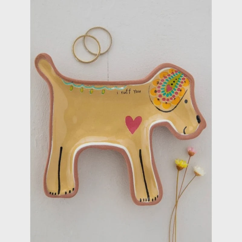 Natural Life Terracotta Trinket Dish - Dog A ceramic wall-mounted dog-shaped holder in warm beige with hand-painted details, including a pink heart, colorful floral pattern on the head, and the text 'I TUFF YOU'