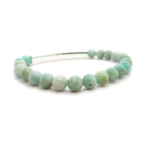 Little Taonga Amazonite Gemstone Bracelet – Aroha to the moon and back A beaded stretch bracelet made of polished round beads in light aqua, mint green, and white with natural marbling