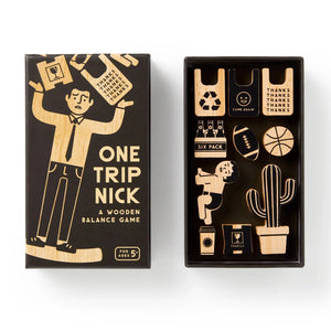 Brass Monkey One Trip Nick Wooden Balance Game Wooden balance game packaging with illustration of a person holding boxes