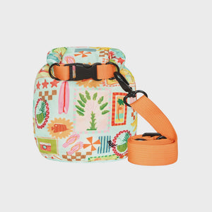 Dock & Bay Dry Bag 5L - Wish You Were Here A small dry bag with a colorful patchwork print featuring beach and tropical motifs, an orange webbing strap, and a black quick-release buckle