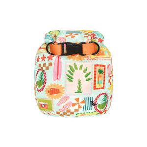 Dock & Bay Dry Bag 5L - Wish You Were Here A small dry bag with a colorful patchwork print featuring beach and tropical motifs, an orange webbing strap, and a black quick-release buckle