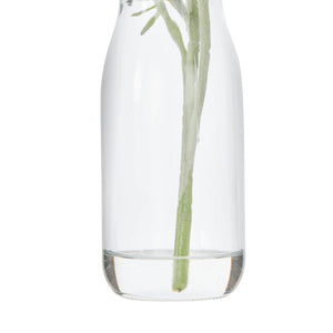 Rogue Cosmos in Milk Bottle Pink Clear glass vase with pink flowers