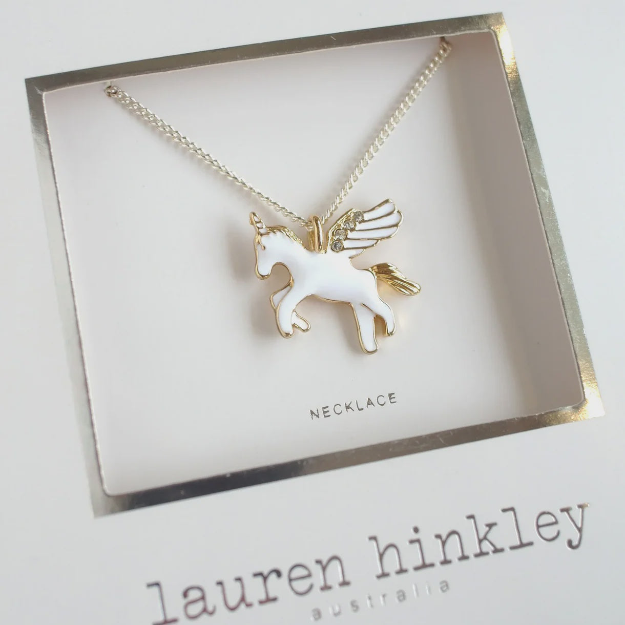 Flying Unicorn Necklace Unicorn necklace on a display card with 'Lauren Hinkley Australia' 