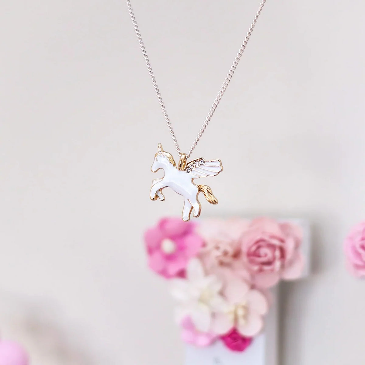 Flying Unicorn Necklace Unicorn necklace on a display card with 'Lauren Hinkley Australia' 