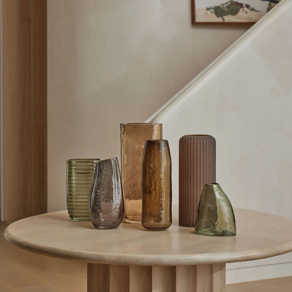 Amalfi Ayla Vase Green A small, asymmetrical translucent glass vase with a smoky gray-green tint